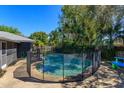 Backyard pool featuring secure fencing for safety and privacy, ideal for relaxation and recreation at 4830 Tellson Pl, Orlando, FL 32812