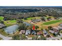 This home is nestled near a scenic pond and a beautiful golf course at 544 Grand Vista Trl, Leesburg, FL 34748