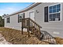 Close-up of a charming home featuring an inviting front entrance and well-maintained siding at 17442 Eve Dr, Montverde, FL 34756