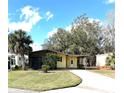 Charming single-story home with a well-maintained lawn and a welcoming front entrance at 224 Westwood Dr, Leesburg, FL 34748