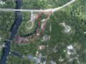 Beautiful aerial view of the property's lush landscape surrounded by greenery, creating privacy at 2886 N C 470, Lake Panasoffkee, FL 33538