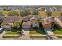 Aerial view of home showing the manicured lawn and neighborhood at 412 Arbor Pointe Ave, Minneola, FL 34715