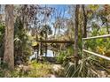 Picturesque backyard dock perfect for waterfront living and enjoying nature at 4723 Cr 306, Lake Panasoffkee, FL 33538