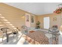 Cozy covered porch features comfortable seating and a welcoming entrance at 520 Saint Andrews Blvd, The Villages, FL 32159