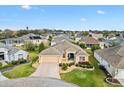 Beautiful aerial view of the home, showcasing its landscaped yard and community at 2197 Derringer Ave, The Villages, FL 32162