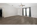 Spacious bedroom featuring new floors, ceiling fan, and ample natural light at 22325 Sw Nectarine Ln, Dunnellon, FL 34431
