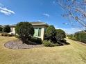 Well maintained backyard featuring a lush lawn and manicured landscaping at 2935 Cedar Grove Loop, The Villages, FL 32163