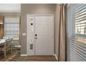 Welcoming entryway featuring a door with side windows and natural light at 5466 Compass Pt # 101, Oxford, FL 34484