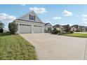 This charming one-story home features a well-manicured lawn, beautiful landscaping, and a two-car garage at 960 Pickering Path, The Villages, FL 32163