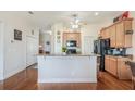 Kitchen with granite countertops, stainless steel appliances, and ample cabinet space at 1037 Green Gate Blvd, Groveland, FL 34736