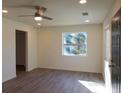 Bright living room with stylish wood flooring, recessed lighting, and neutral paint at 2210 Grant Ave, Eustis, FL 32726