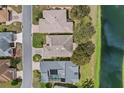 Overhead view of houses showing roof types and the surrounding community at 321 Ranchwood Dr, Leesburg, FL 34748