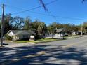 Street view showcasing a one story commercial building featuring well maintained lawn and elegant signage at 911 N Donnelly St, Mount Dora, FL 32757