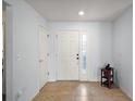 Bright and airy foyer featuring tile flooring, and ample natural light with neutral walls at 11945 Se 91St Cir, Summerfield, FL 34491