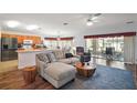 Comfortable living room featuring modern furnishings and an open floor plan with a view to the kitchen at 11945 Se 91St Cir, Summerfield, FL 34491