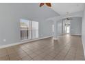 Spacious living room with tile floors, high ceilings and natural light at 16628 Citrus Pkwy, Clermont, FL 34714