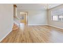 Bright living room featuring hardwood floors, a large window, and a chandelier at 201 Andover Dr, Davenport, FL 33897