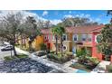 A colorful row of townhomes with palm trees and convenient parking at 2754 Sun Key Pl, Kissimmee, FL 34747