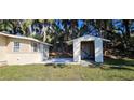 Exterior shot of storage shed near the home featuring new white paint and ample storage space at 709 S Highland St, Mount Dora, FL 32757