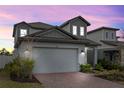 Charming two-story home featuring a brick driveway and well-manicured landscaping at 2289 Mystic Maze Ln, Minneola, FL 34715