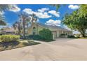 Exterior view of house showing driveway, landscaping, and attached garage at 2746 Park Royal Dr, Windermere, FL 34786