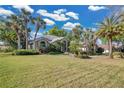 Expansive lawn leads up to an inviting single-story home with a well-maintained exterior at 2746 Park Royal Dr, Windermere, FL 34786