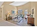 Bright living room features tile flooring, arched windows, and elegant furnishings at 2746 Park Royal Dr, Windermere, FL 34786