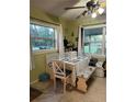Bright dining area with built-in bench seating and a view of the backyard through the windows at 43648 S Island Dr, Paisley, FL 32767