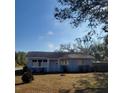 Charming single-story home featuring a well-kept lawn and a classic, inviting facade at 115 N Galena Ave, Minneola, FL 34715