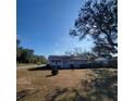 Classic single-story home with a traditional design and a cozy, welcoming appearance in a lush setting at 115 N Galena Ave, Minneola, FL 34715