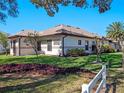 The back of the home features a well-manicured yard and a cozy, private atmosphere at 21850 Tartan St, Leesburg, FL 34748