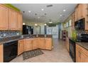 Spacious kitchen featuring granite countertops, tile backsplash, stainless appliances, and ample cabinet space at 303 White Water Bay Dr, Groveland, FL 34736