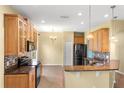 Well-equipped kitchen with granite countertops and stainless steel appliances at 303 White Water Bay Dr, Groveland, FL 34736