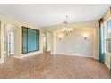 Spacious living room featuring tile floors, decorative walls, and a view to other rooms at 303 White Water Bay Dr, Groveland, FL 34736
