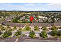 Aerial view of a residential area featuring well-maintained lawns and mature trees at 3206 Sonesta Ct # A, Clermont, FL 34711