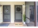 Inviting front entrance with decorative wreath and welcome mat, and unit number, creating a warm ambiance at 7266 Swallow Run # 7266, Winter Park, FL 32792