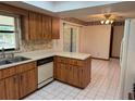 Functional kitchen featuring ample counter space, white appliances, and access to the dining area at 1009 Linda Glen Ave, Fruitland Park, FL 34731