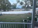 Expansive backyard featuring a well-maintained lawn and full fence at 11428 Pheasant Trl, Leesburg, FL 34788