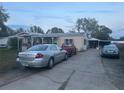 Wide driveway leads to a cozy home with ample parking space at 11428 Pheasant Trl, Leesburg, FL 34788