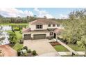 A stunning aerial view of the home and neighborhood located on the lake at 11579 Acosta Ave, Orlando, FL 32836