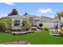 Charming home with a well-maintained lawn and mature landscaping at 1367 Honea Path, The Villages, FL 32162