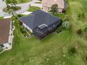 Aerial view of the home, landscaping, backyard and screened patio area at 17126 Se 117Th Cir, Summerfield, FL 34491