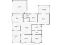 Layout of the house shows the spacious kitchen, large living room, and four bedrooms at 25013 Adair Ave, Sorrento, FL 32776