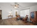 Inviting living room featuring hard wood floors and natural light at 40619 W 3Rd Ave, Umatilla, FL 32784