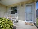 Inviting front porch with rocking chairs and a welcoming 