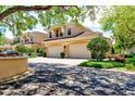 Charming townhome with a two-car garage, lush landscaping, and a serene, inviting atmosphere at 54 Camino Real Blvd # 504, Howey In The Hills, FL 34737