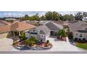 Overhead view of the property, showcasing its location in a neighborhood with manicured lawns at 5551 Purslane Pl, The Villages, FL 32163