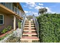 Exterior concrete stairwell with metal railings leading to the second level units at 1100 E Caroline St # 218, Tavares, FL 32778