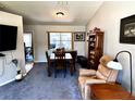 This is a view of the living room with a vaulted ceiling, ceiling fan, and neutral gray walls at 1108 Ben Hope Dr, Leesburg, FL 34788