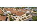 Aerial view of the back of the house showcasing the outdoor patio and surrounding landscaping at 1202 San Bernardo Rd, The Villages, FL 32162